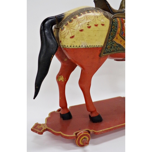 101 - Good quality Indian folk art carved wooden horse on wheels, with hand painted decoration, 82 x 86cm