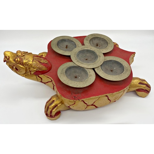 102 - Carved Chinese Ceng Ceng (turtle cymbals) gilt highlights on a red ground, 48cm long