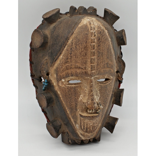 112 - Tribal interest - Nigerian Yoruba People, Idoma mask, carved wood with attachments, 27 x 20cm