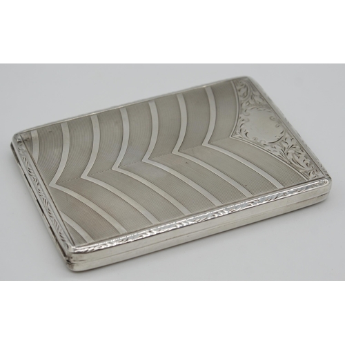 262 - Good quality continental white metal cigarette case, engraved with geometric and scrolled decoration... 