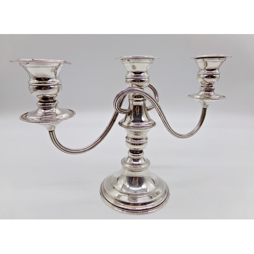 266 - Silver plated three branch candelabra, 20cm high