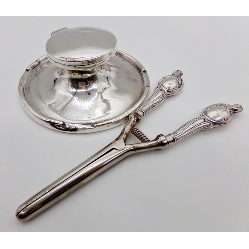 271 - George V silver capstan inkwell with a pair of silver handled glove stretchers (2)