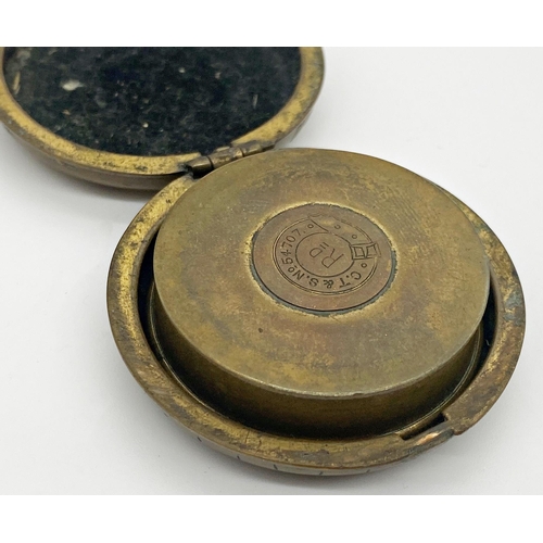 427 - Early 20th century brass cased pocket compass and telescopic drinking cup, 50mm case inscribed verso... 