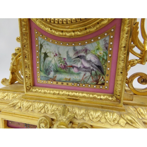 473 - Good quality French ormolu mantle clock, fitted with Sevres style porcelain panels hand painted with... 