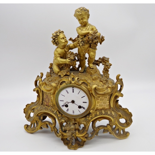 474 - Good quality French ormolu figural mantle clock, mounted by two Bacchus cherubs with further Rococo ... 