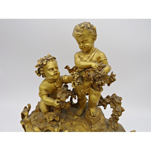 474 - Good quality French ormolu figural mantle clock, mounted by two Bacchus cherubs with further Rococo ... 