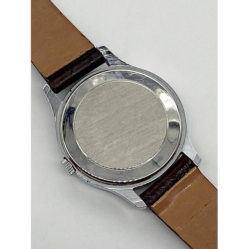 447 - A new old stock Ingersoll stainless gents wristwatch, 34mm case, with original Ingersoll strap