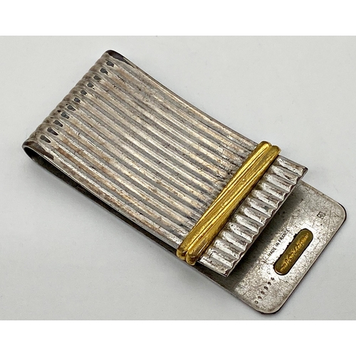 455 - A vintage gold and silver plated Must de Cartier Money clip, 5.5 x 2.5cm