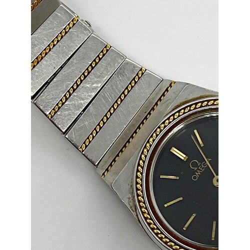 391 - Vintage Omega Constellation bi-colour ladies wristwatch, 26mm case, black dial with gilt hands and m... 