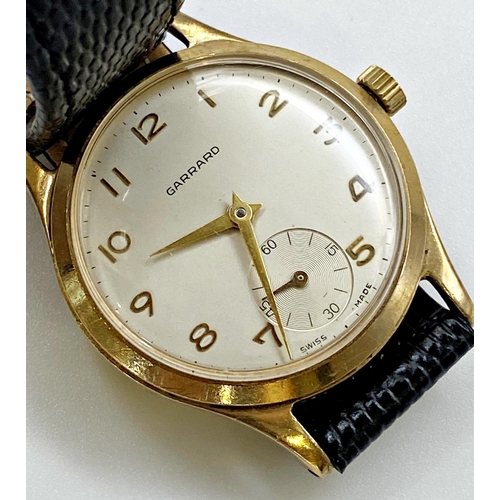 411 - Vintage Garrard 9ct gold mid size wristwatch, 30mm case, champagne dial with gilt hands and Arabic n... 