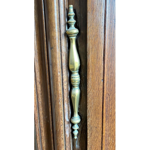 580 - Massive 19th century French fruitwood armoire, moulded cornice over fancy panelled doors enclosing a... 