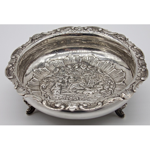 192 - Late Victorian import silver pedestal dish, centrally embossed with a romantic garden scene, maker W... 