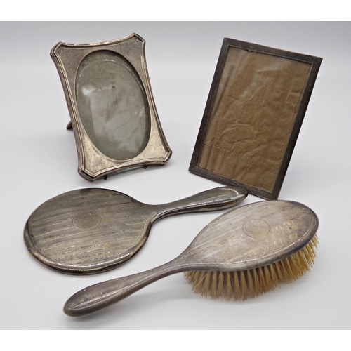 213 - Two silver mounted easel frames and silver dressing brush and mirror