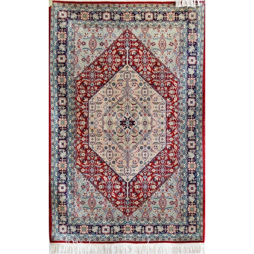 117 - Full pile Persian Tabriz rug, with scrolled floral decoration upon a sky blue ground, 200 x 125cm