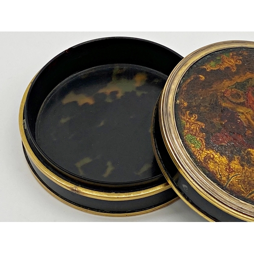 170 - Antique tortoiseshell circular lidded box, the top lacquered with a romantic scene, 9.5cm diameter