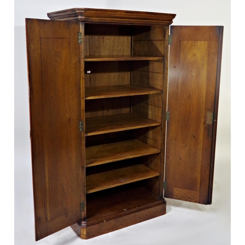 517 - 19th century fruitwood cupboard of small proportions, the twin panel doors enclosing a shelved inter... 