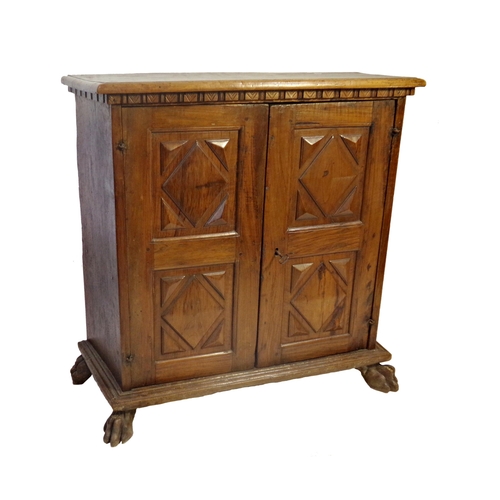 527 - 18th century Italian walnut cupboard, geometric panelled doors enclosing a shelved interior on paw f... 