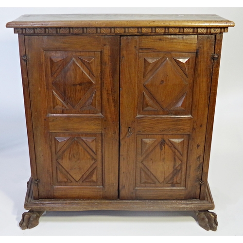 527 - 18th century Italian walnut cupboard, geometric panelled doors enclosing a shelved interior on paw f... 