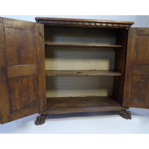 527 - 18th century Italian walnut cupboard, geometric panelled doors enclosing a shelved interior on paw f... 