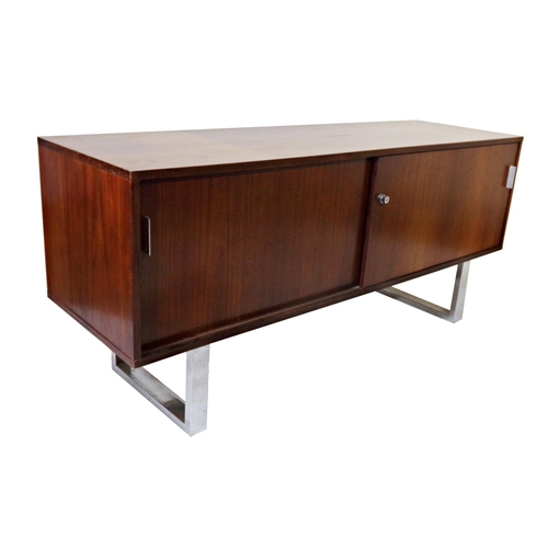 123 - Trevor Chinn for Gordon Russell 'Prestige' sideboard, rosewood with chrome legs, sliding doors enclo... 