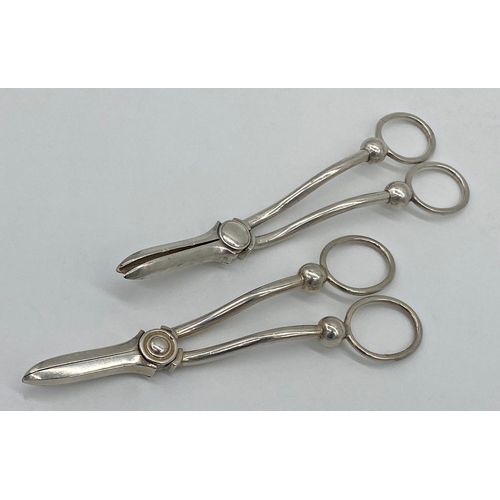 34 - Two pairs of grape scissors, one silver the other silver plate (2)