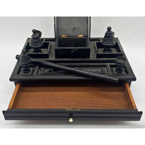 331 - Impressive North-Indian ebony desk standish, mounted by an elephant in ceremonial dress with various... 