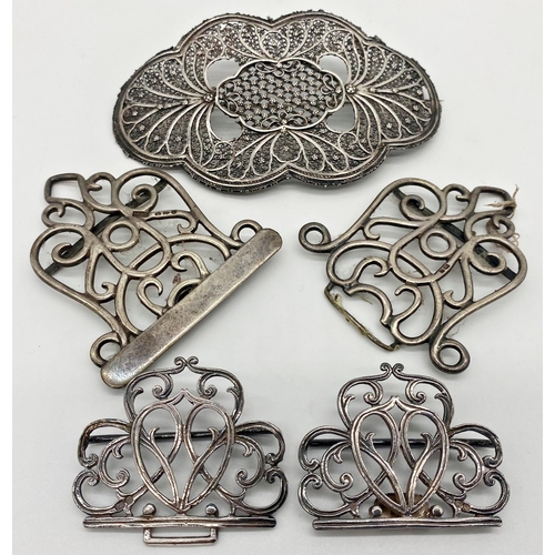 74 - Two antique silver buckles with scrolled pierced decoration, with a further good filigree silver hai... 