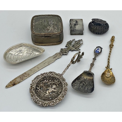 76 - Collection of Continental and foreign silver and white metal to include strainer spoon, letter knife... 