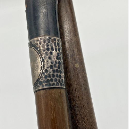 368 - A horn handled, silver collard bamboo walking cane together with a further crook handle dog headed c... 