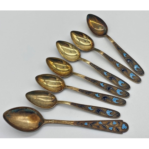 105 - Suite of Russian silver gilt and enamel spoons, six teaspoons and lager spoon, 4oz approx