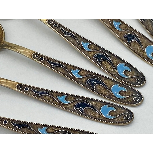 105 - Suite of Russian silver gilt and enamel spoons, six teaspoons and lager spoon, 4oz approx