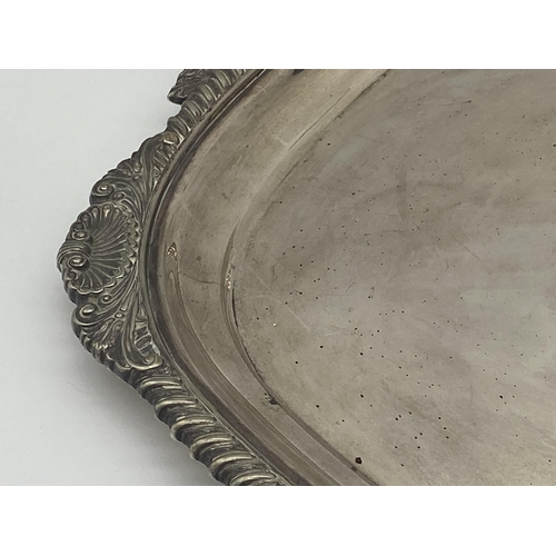 8 - Very large silver plated twin handled tray, with cast scallop shell boarders, by Walker & Hall, 76cm... 