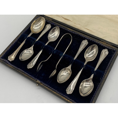 110 - Cased early 20th century silver harlequin suite of six fancy teaspoons with sugar tongs, maker HF & ... 