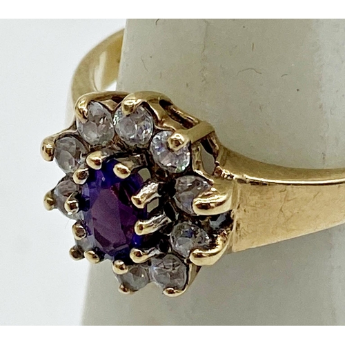 161 - 9ct white stone and amethyst flower head cluster ring, size P