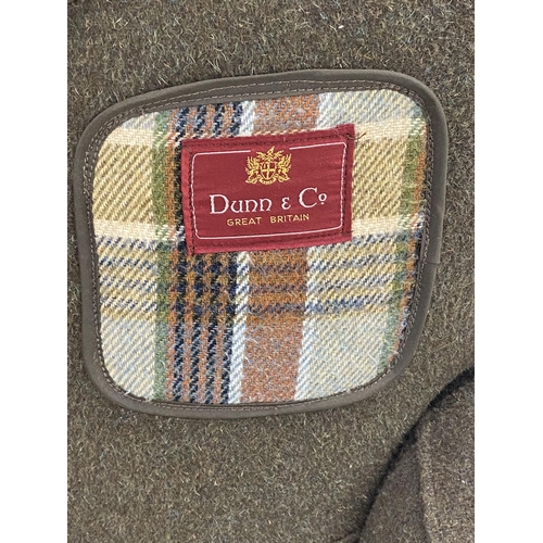 1132 - Novelty lounge chair in the form of a gentleman's overcoat by Dunn & Co. made of Harris tweed on tur... 