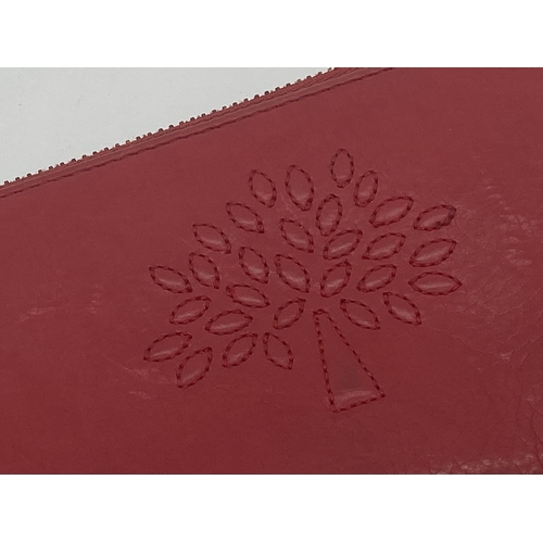 349 - Mulberry red leather purse in original box
Measures 20cm x 10cm