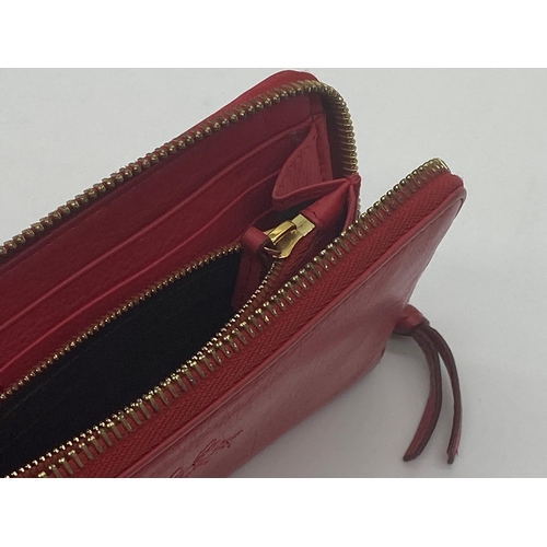 349 - Mulberry red leather purse in original box
Measures 20cm x 10cm