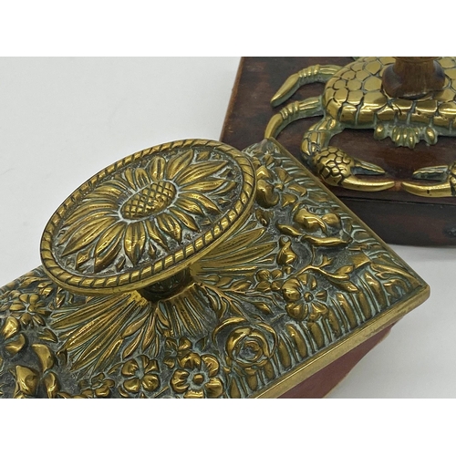 350 - Unusual novelty blotter the top mounted by a brass crab together with a further embossed brass toppe... 