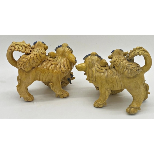 493 - Unusual pair of Chinese pottery Dogs of Fo in famille jaune playing with their young, with blue high... 