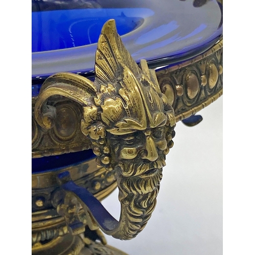 356 - Quite remarkable Georgian gilt cast metal centrepiece with four grotesque head handles upon stepped ... 