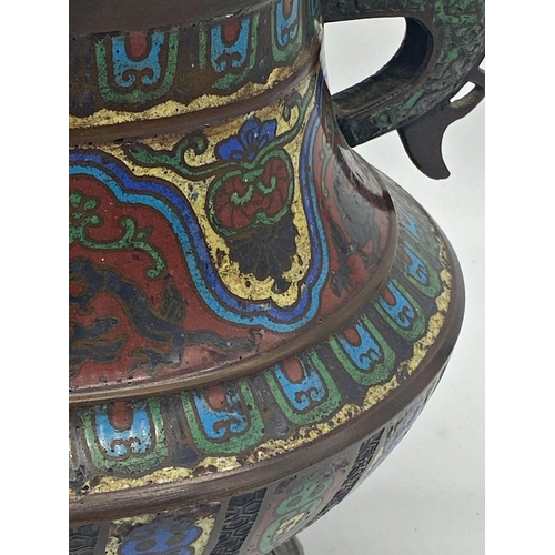 495 - Good Japanese bronze and cloisonne twin handled koro, the lid mounted by a seated Dog of Fo, 38cm hi... 