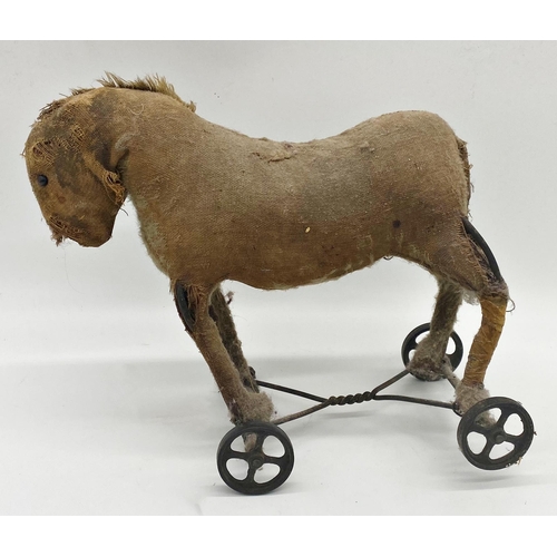 361 - Vintage straw stuffed pull-along toy of a donkey, 32cm long (af) together with two wooden pull-along... 