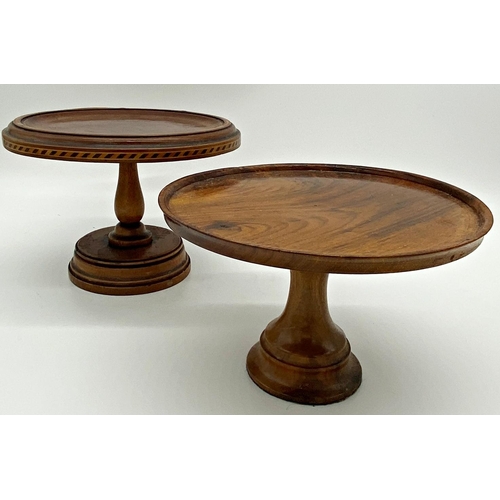 379 - Two treen tazzas, one with inlaid parquetry rim, the largest 25cm diameter x 19cm high (2)