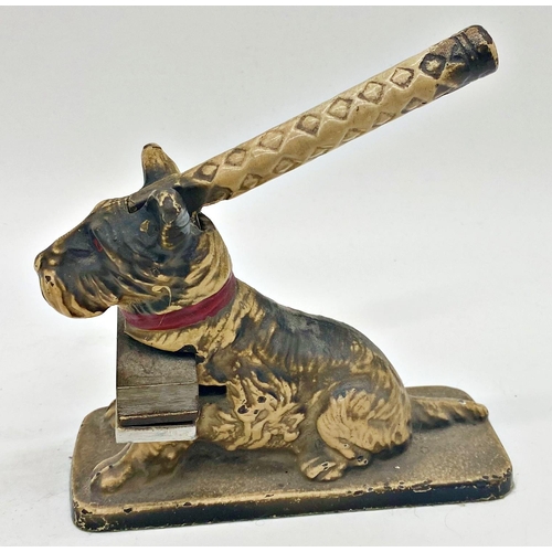 381 - A mixed dog lot to include a cast iron stamp in the form of a seated terrier, a brush with a terrier... 