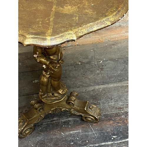 1148 - 19th century gilt and gesso centre table, the serpentine top with nude cherub column upon a scrolled... 