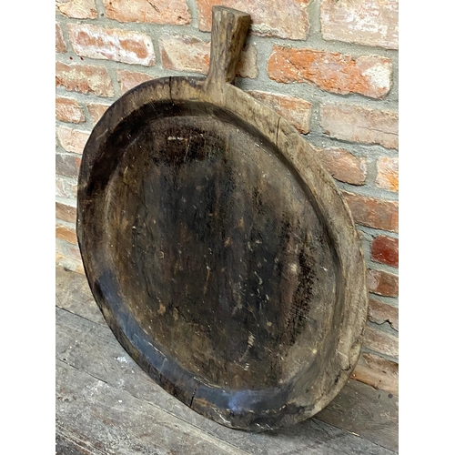 431 - Unusually large rustic, possibly Indian, treen pan, 90cm wide