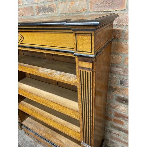 1157 - Biedermeier satinwood twin bookcase with ebony inlay, the shelved interior flanked by pillars and re... 