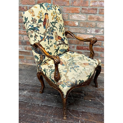 1205 - Good quality carver lounge chair, with tropical bird upholstery, the arms and framework carved with ... 