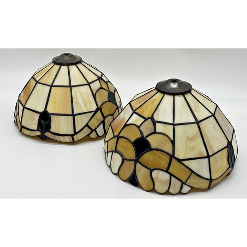 1063 - A pair of Tiffany style leaded glass light shades, 26cm diameter