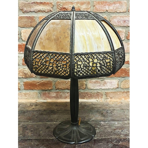 1061 - A large four light Art Nouveau table lamp with large faceted glass shade with pierced metal mounts u... 